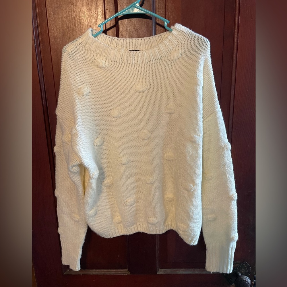 Cream colored sweater. Size large.